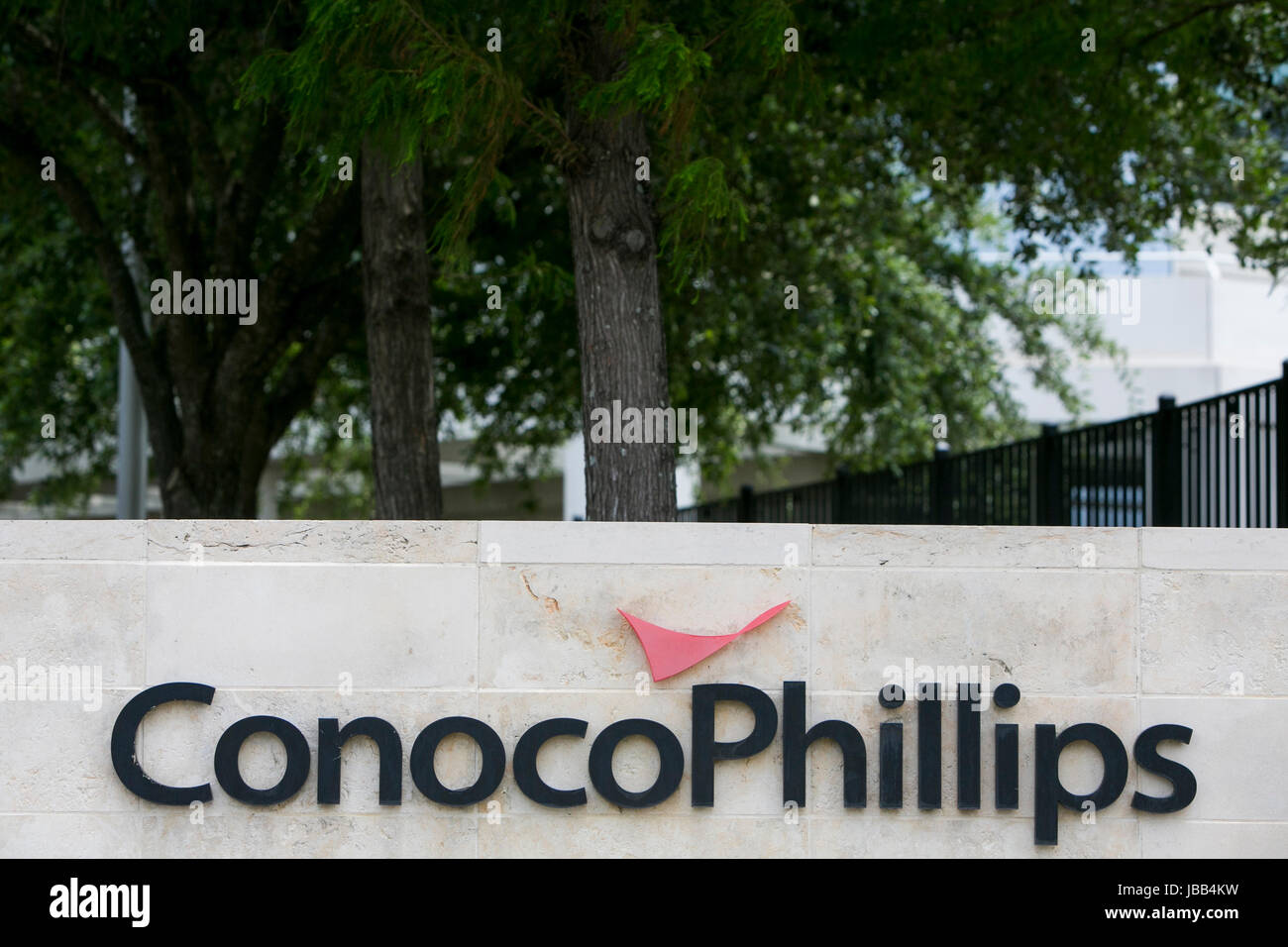 A logo sign outside of the headquarters of the ConocoPhillips Co., in Houston, Texas, on May 27, 2017. Stock Photo