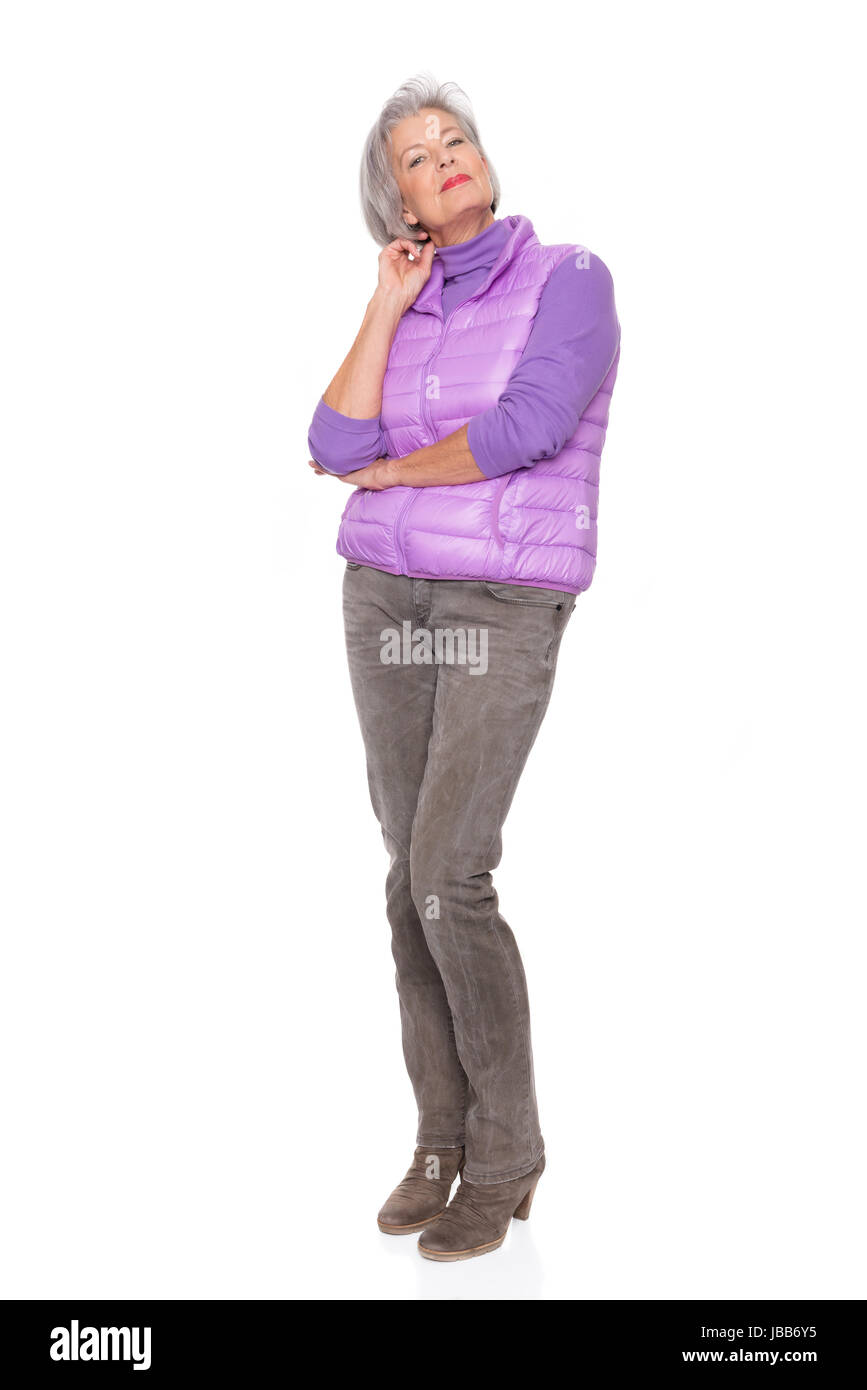 Studioaufnahme einer Frau mittleren Alters vor weißem Hintergrund Stock Photo