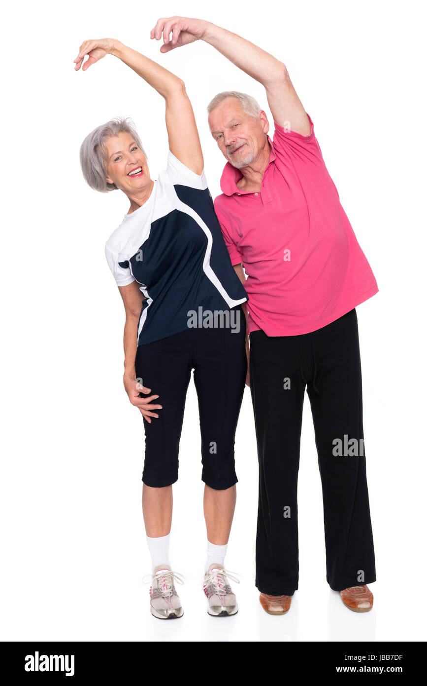Sportliche Seniorenpaar vor weißem Hintergrund Stock Photo