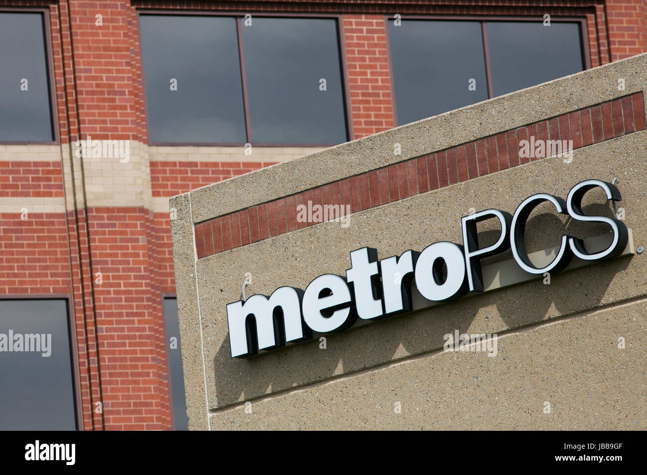 A logo sign outside of the headquarters of MetroPCS Communications, Inc., in Richardson, Texas, on May 29, 2017. Stock Photo
