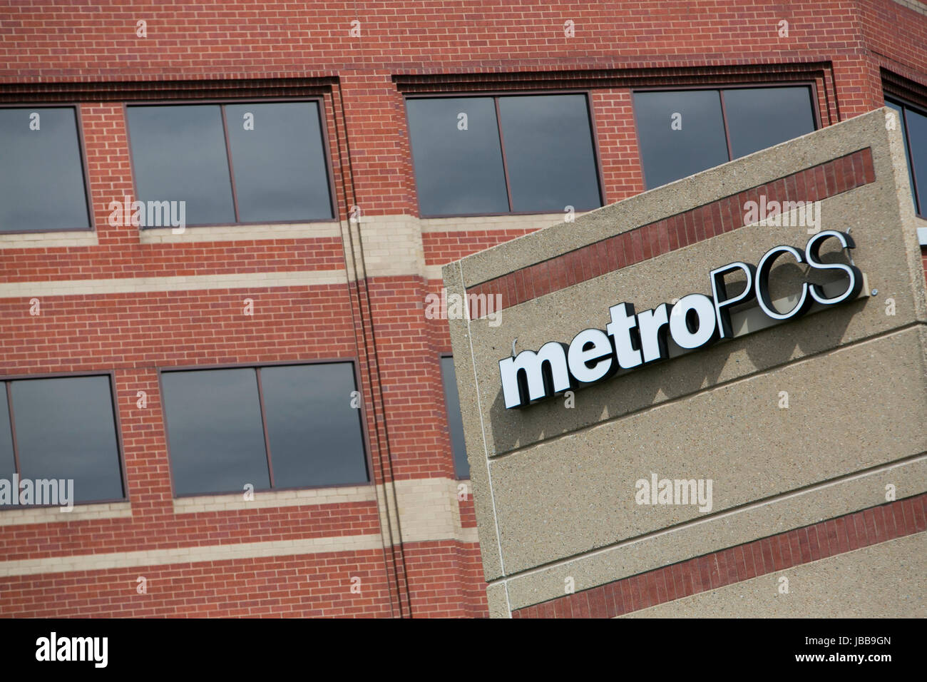 A logo sign outside of the headquarters of MetroPCS Communications, Inc., in Richardson, Texas, on May 29, 2017. Stock Photo