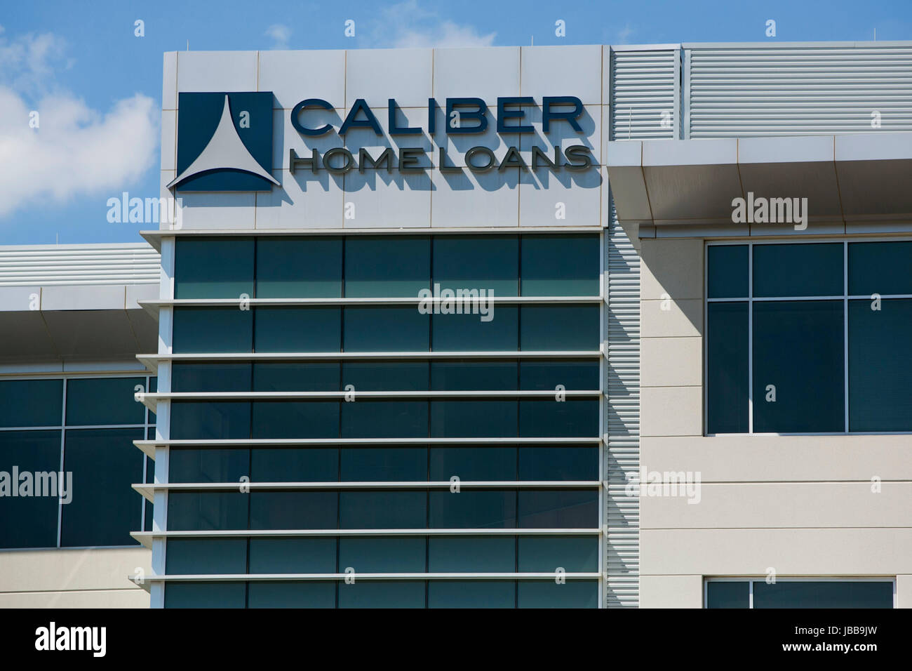 A logo sign outside of the headquarters of Caliber Home Loans, Inc., in Irving, Texas, on May 29, 2017. Stock Photo