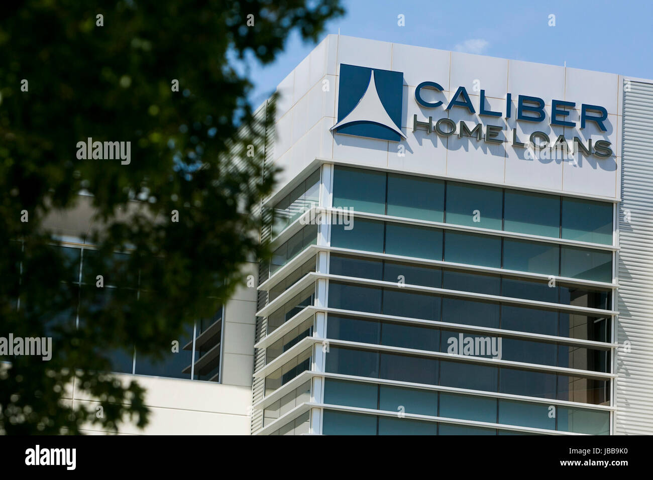 A logo sign outside of the headquarters of Caliber Home Loans, Inc., in Irving, Texas, on May 29, 2017. Stock Photo