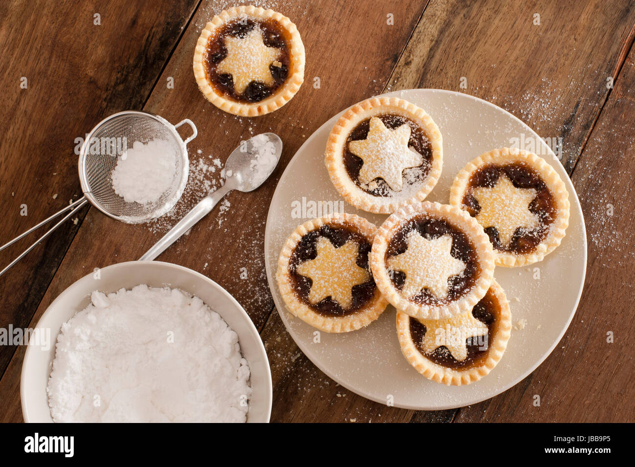 Traditional Christmas fruit mince pies decorated with pastry stars on a ...