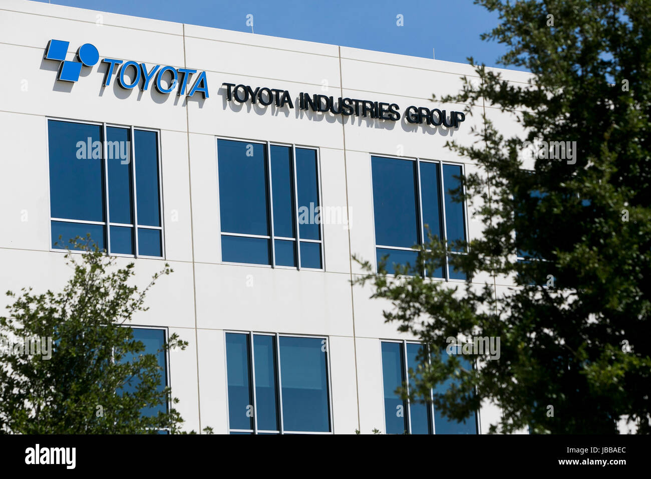 A logo sign outside of a facility occupied by the Toyota Industries ...