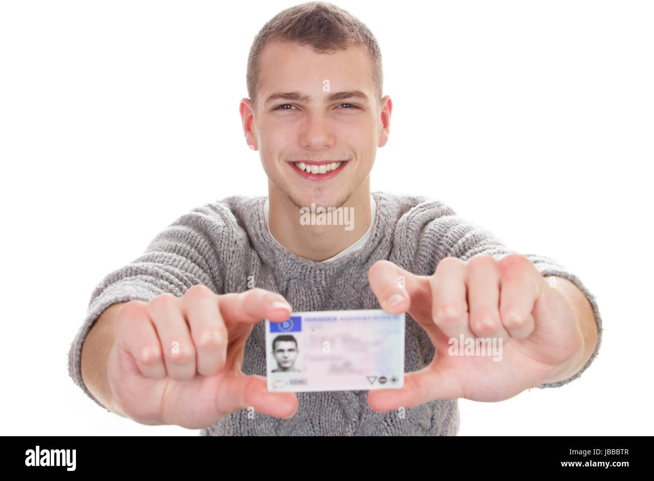 16 to 18 year old boy just received his driver license Stock Photo - Alamy