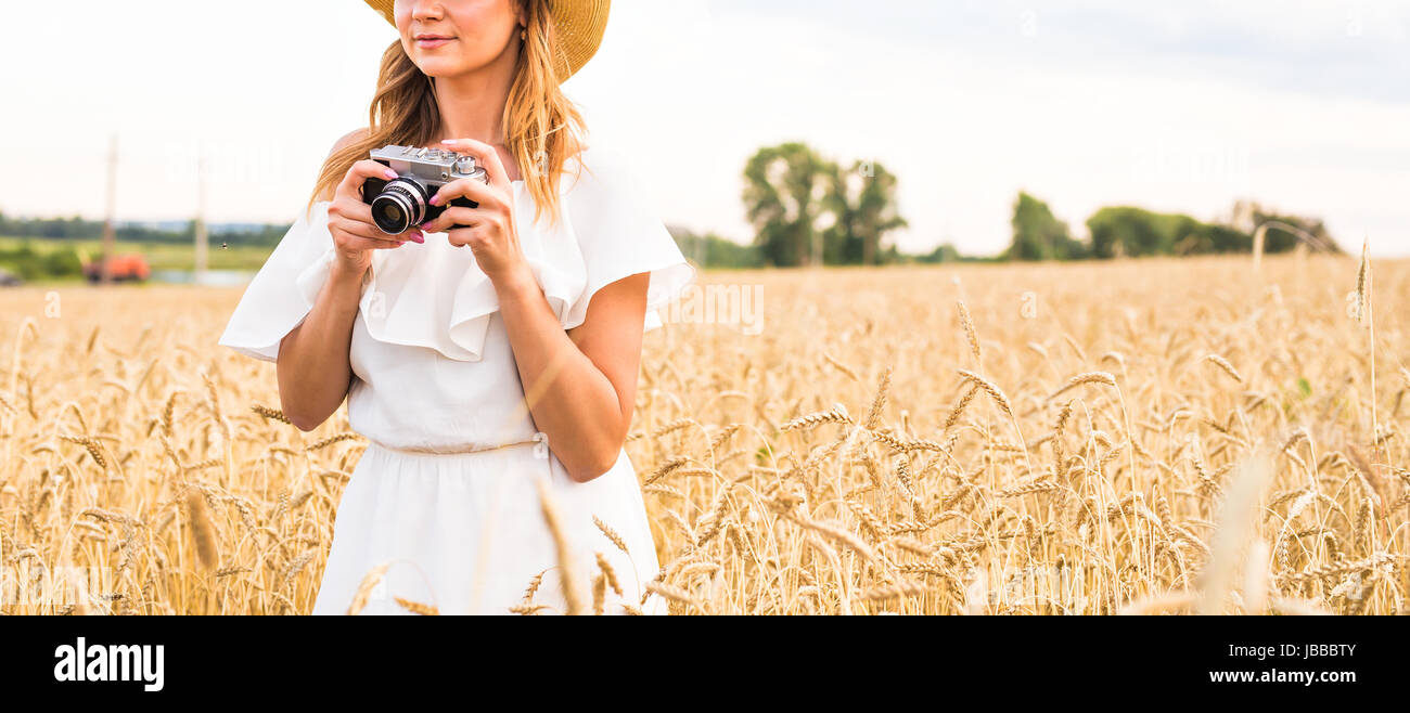 Woman holding retro camera close-up Stock Photo - Alamy