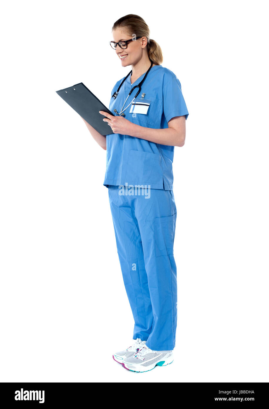Female surgeon looking at reports isolated on white background Stock ...