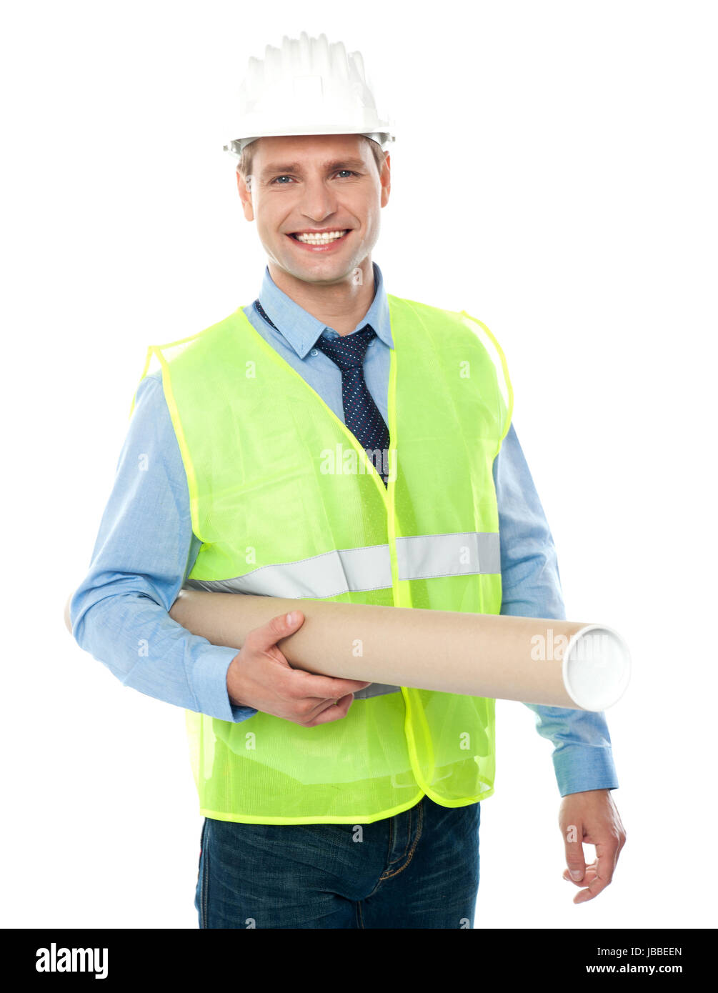 Young architect wearing protective helmet holding construction map