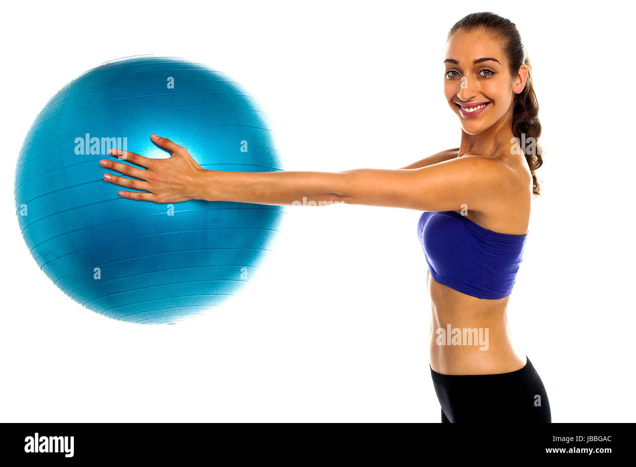 Side view of a fitness enthusiast holding a swiss ball. Casual shot Stock Photo