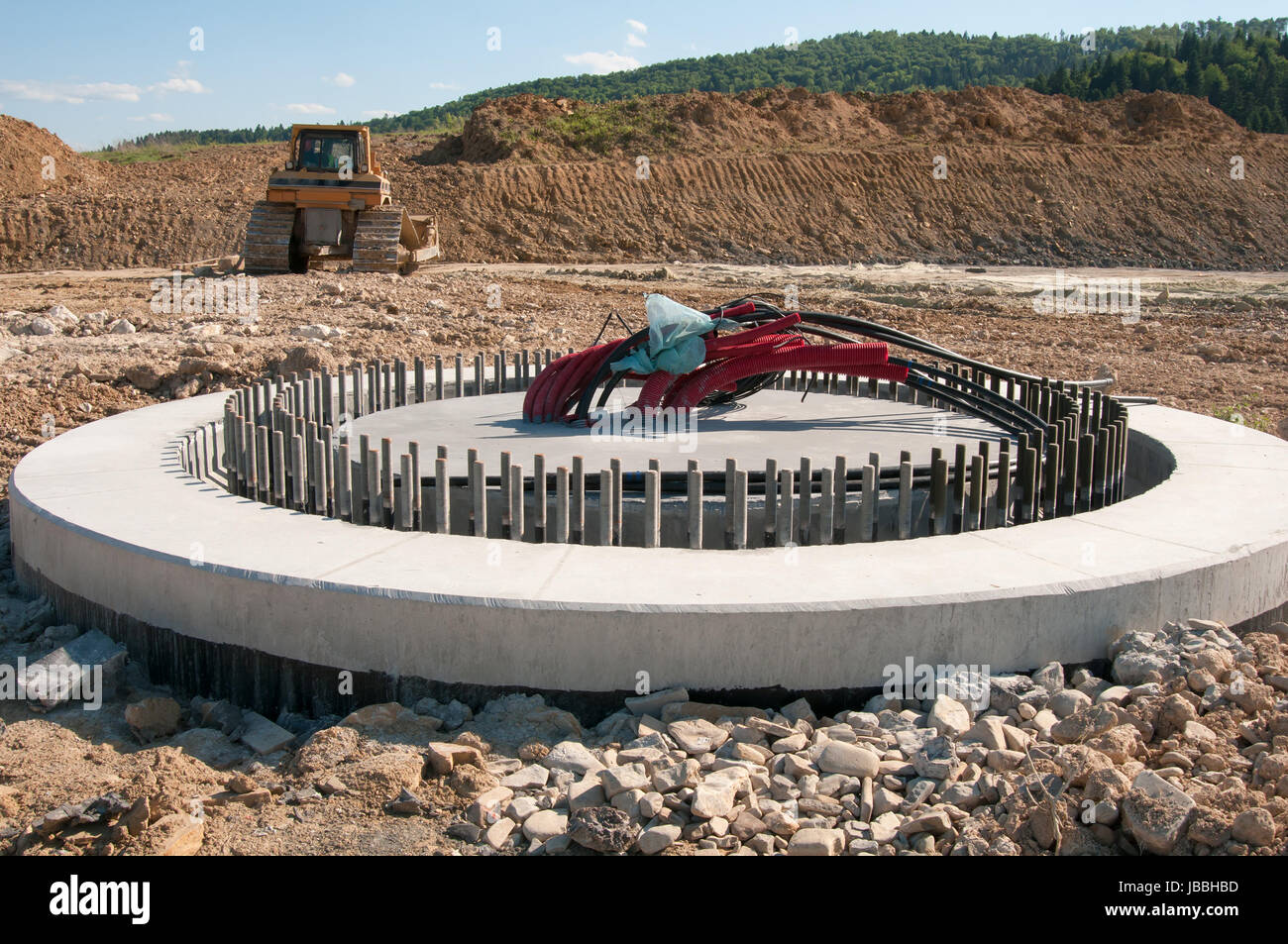 concrete foundation ready to be assembled on new wind turbine farm Stock Photo