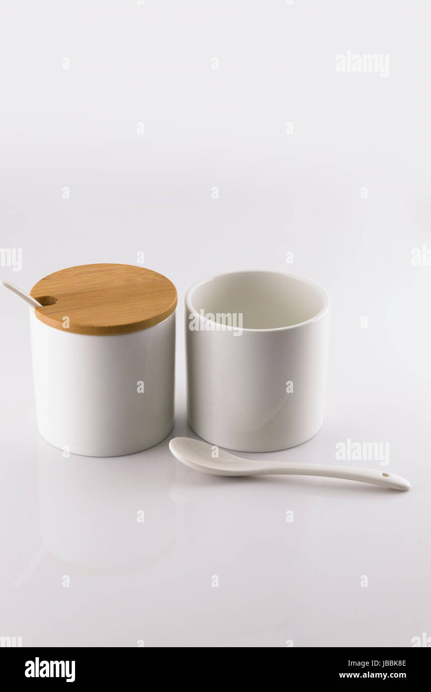 Two white ceramic cup for placing condiments Stock Photo Alamy