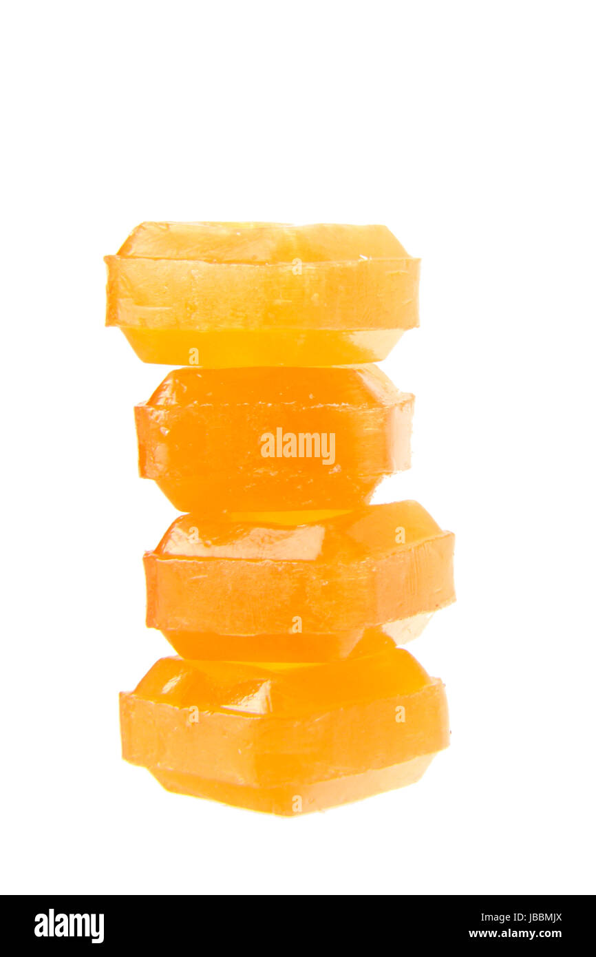 orange flavoured hard candy isolated on the white background Stock