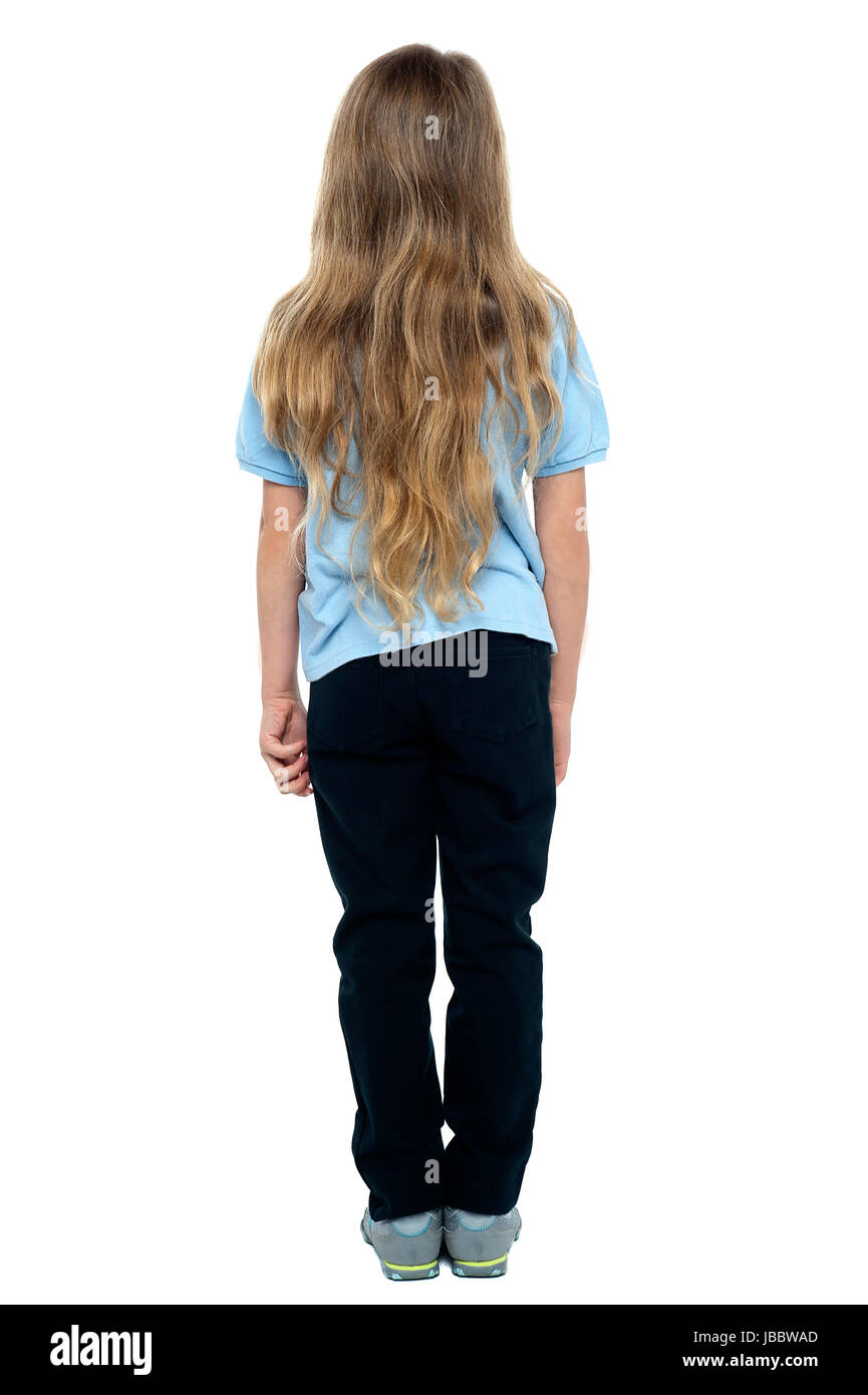 Rear view of a young blonde girl with long hair, full length portrait ...
