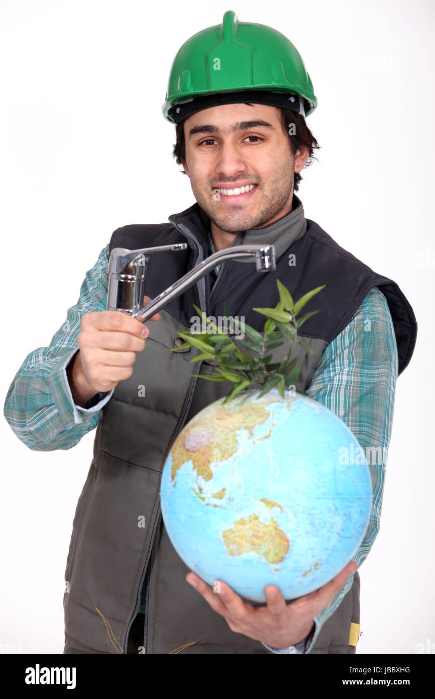 Plumber installing a worldwide water supply system Stock Photo Alamy