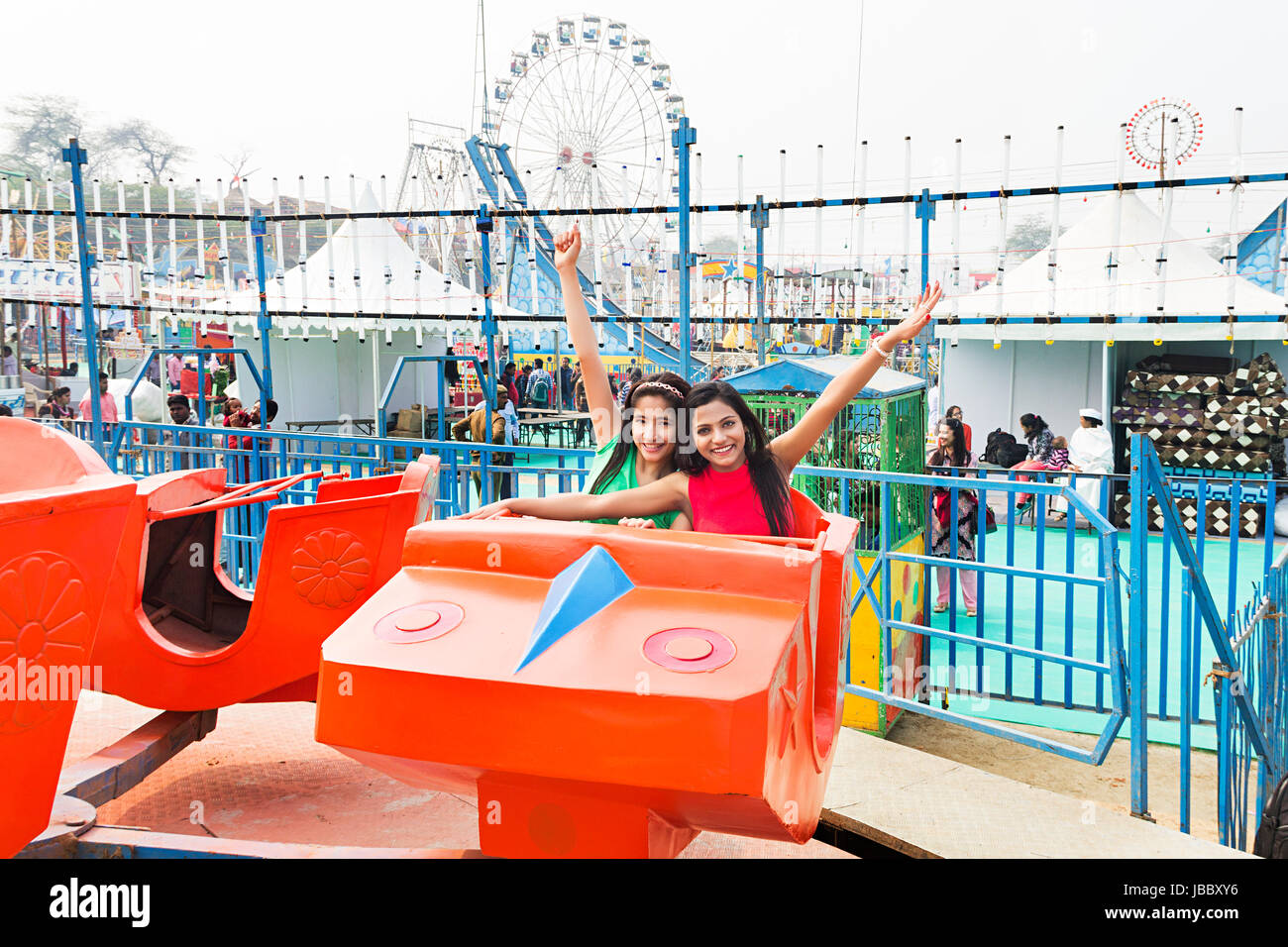 2 Young Women Friend Riding Jhula Fun Cheerful Amusement Park Stock ...