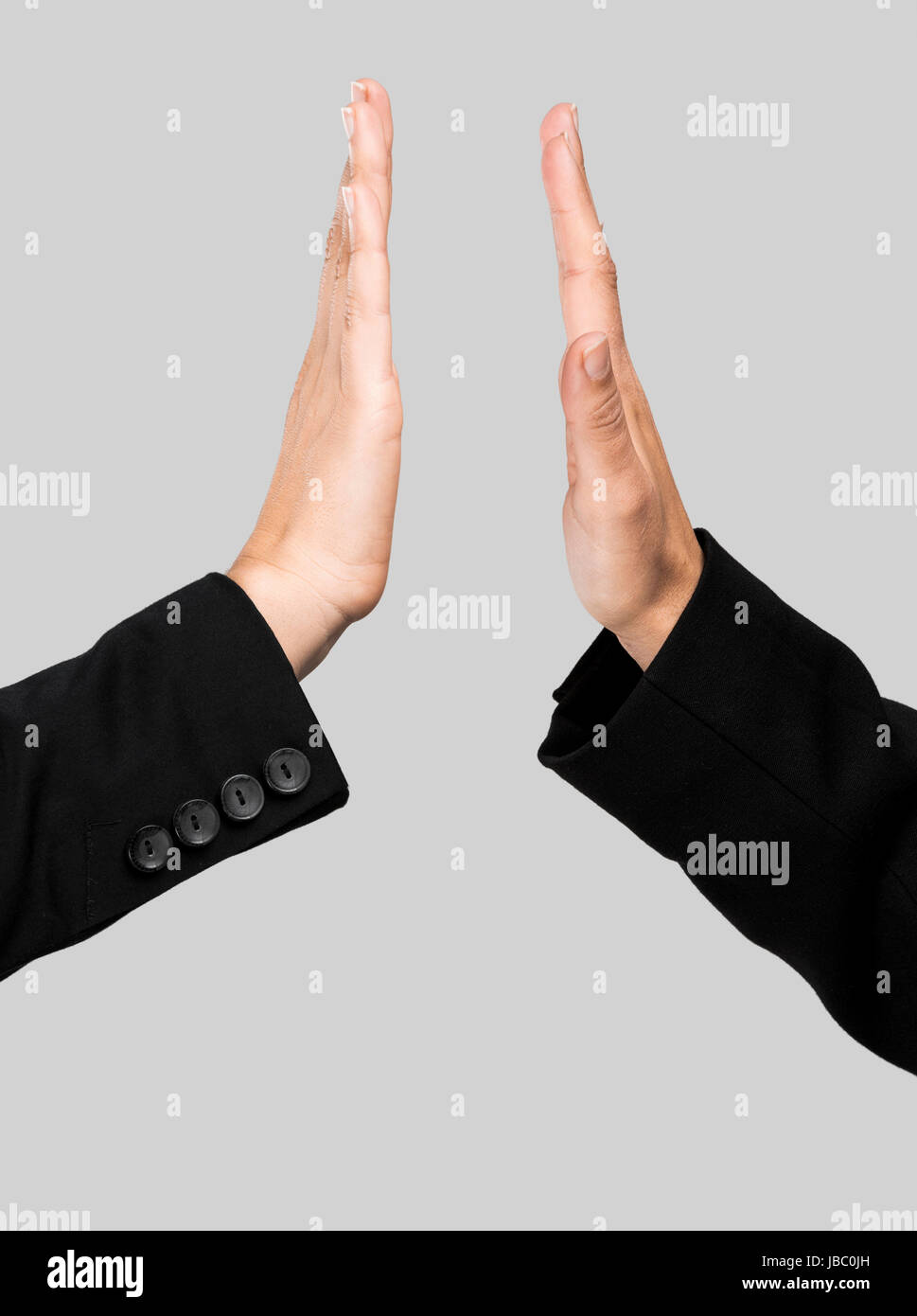 Hands Making A Give Me Five Compliment Over A Gray Background Stock Photo Alamy