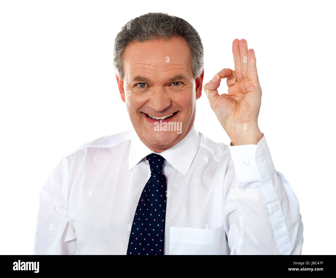 Aged boss showing excellent gesture in front of camera Stock Photo - Alamy