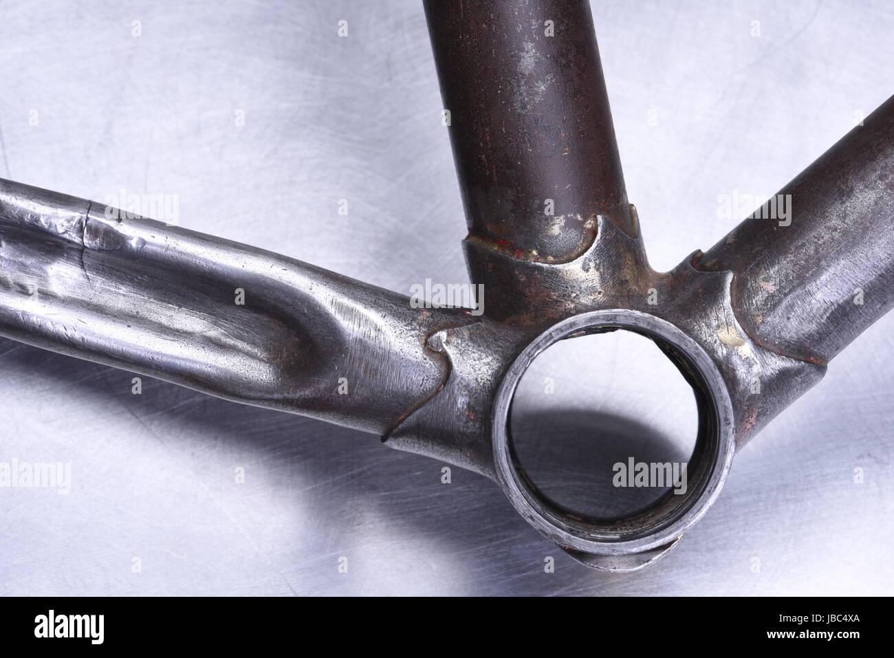 Restoring detail of old steel bike Stock Photo