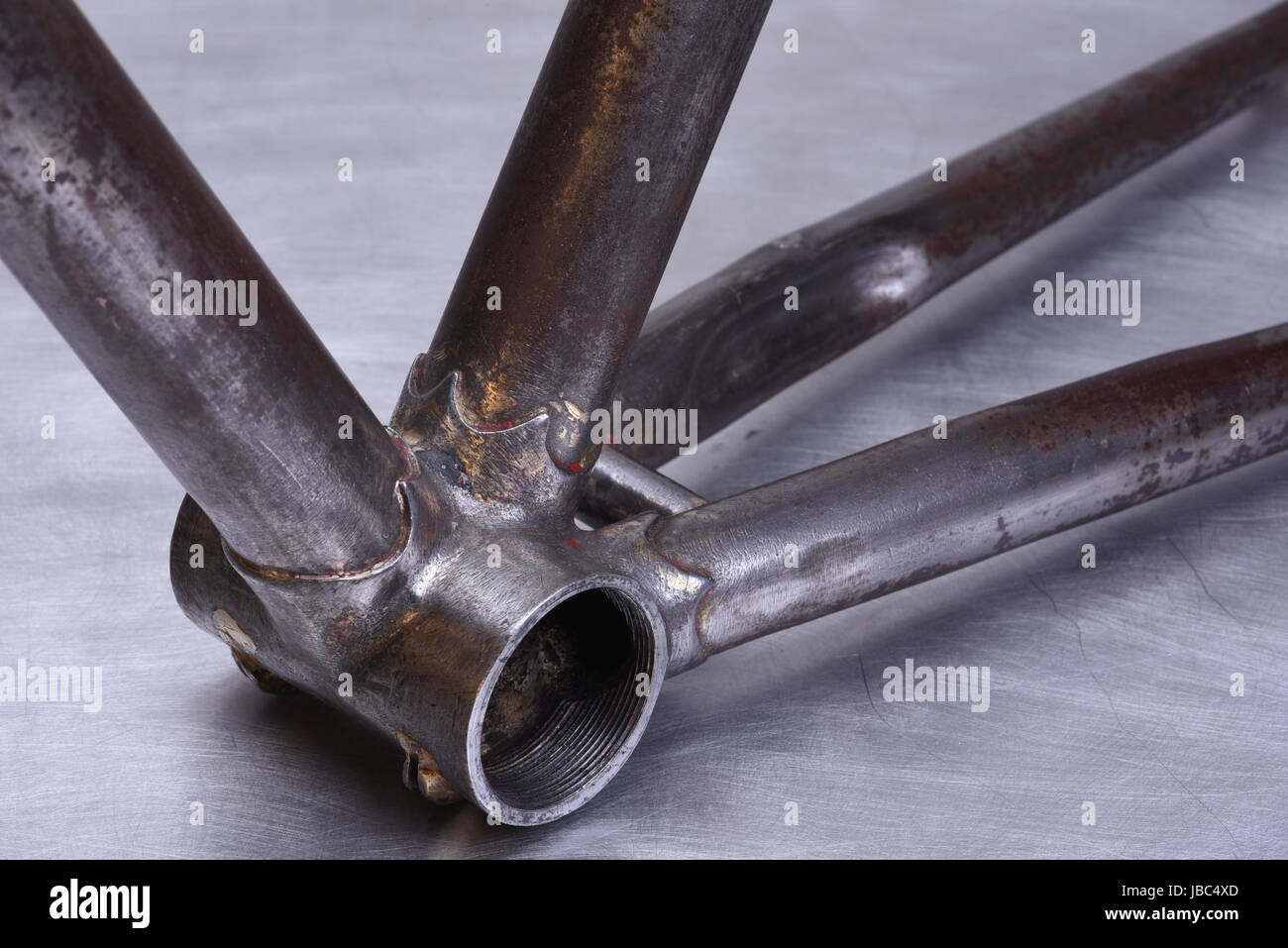 Restoring detail of old steel bike Stock Photo