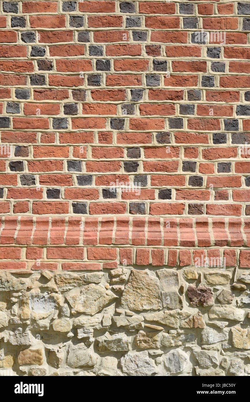 Red brick and sandstone wall background Stock Photo