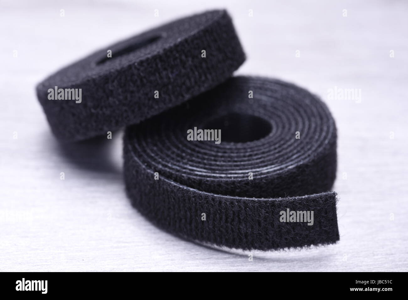 Roll of Velcro Tape on Gray Metal Surface Stock Photo - Alamy