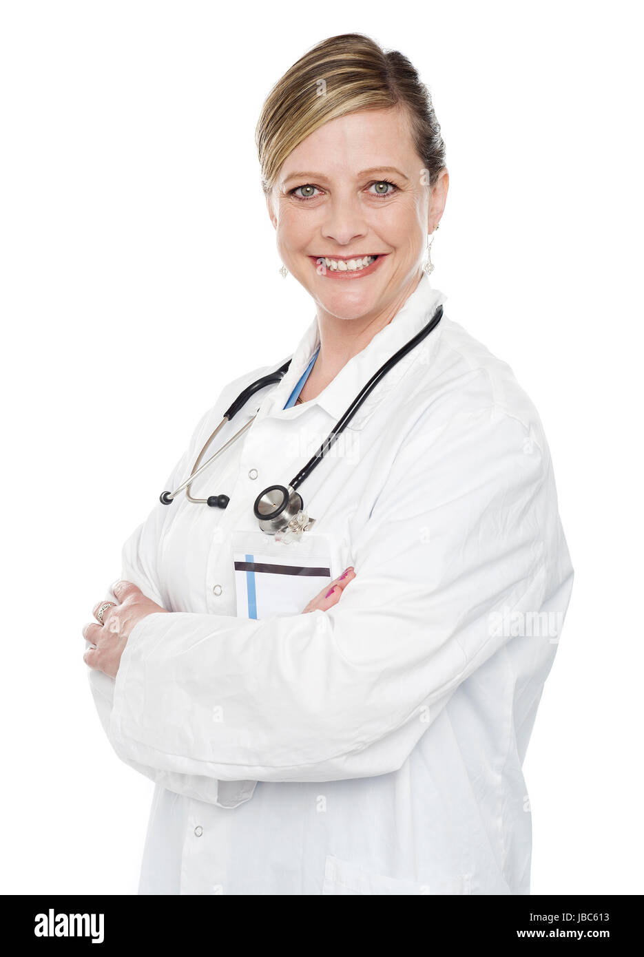 Female medical specialist posing with crossed arms isolated over white background Stock Photo