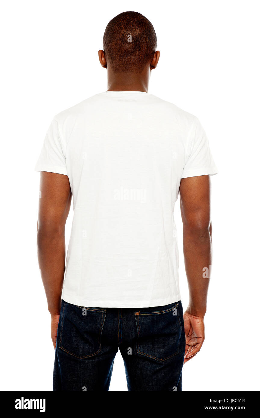 Rear view of casual young guy looking at white wall Stock Photo - Alamy