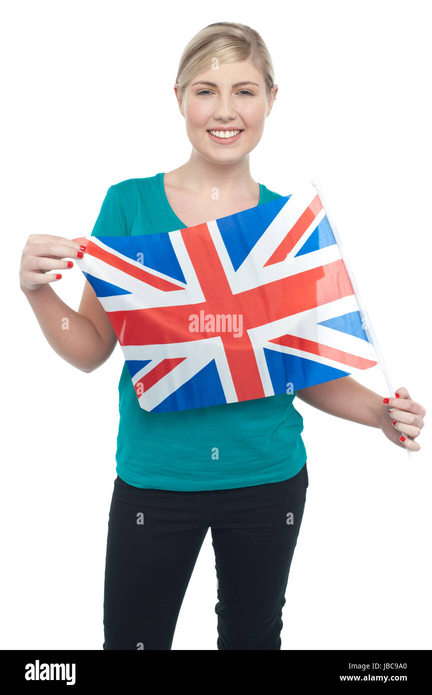 Patriotic UK teen supporter displaying national flag over white background. Stock Photo