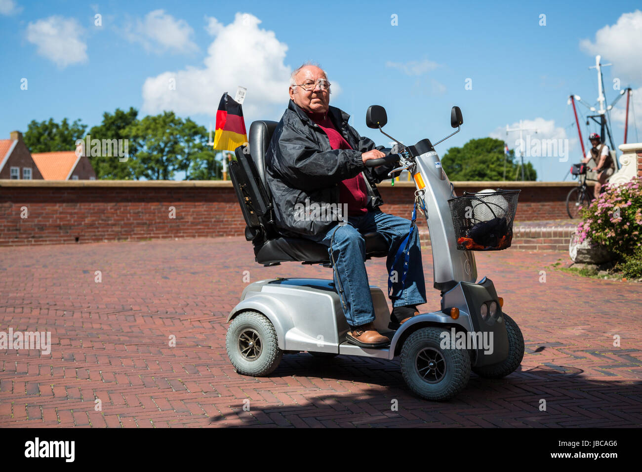 Greetsiel, Germany, a man traveling with an electric car Stock Photo