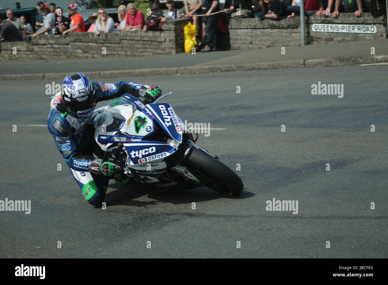 Isle Of Man, British Isles (UK). 9th June, 2017.  Fan Favorite, number 4, Ian Hutchinson on his Tyco BMW at Cruickshank's Corner, Ramsey, Isle of Man. 'Hutchy' was airlifted to hoispital after he suffered a fractured femur when he crashed his motorcycle near the 27th milestone on the Mountain Road on lap two of the race. The race was red flagged and restarted over four laps at 5.15pm. Pokerstars Senior TT Race. (Detailed competitor information: https://www.iomtt.com/TT-Database.aspx) Credit: Louisa Jane Bawden/Alamy Live News. Stock Photo