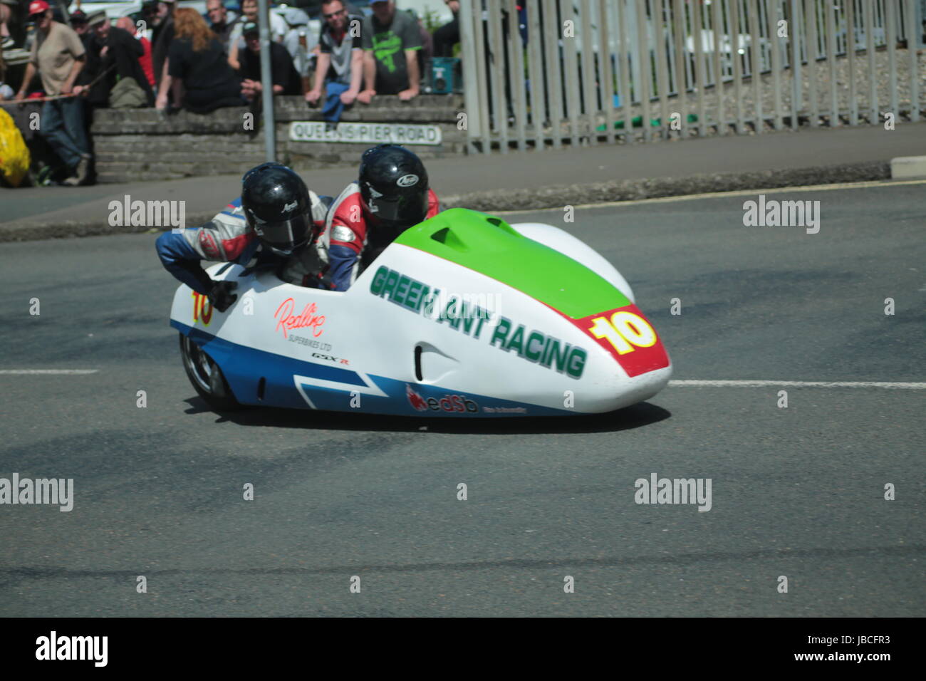 Isle Of Man, British Isles (UK). 9th June, 2017.  Fan Favorite, number 10 Gary Knight and Daniel Evanson (Green Ant / Redline Superbikes with Dialled-in Racing) at Cruickshank's Corner, Ramsey, Isle of Man, UK. Sure Sidecar TT Race 2. (Detailed competitor information: https://www.iomtt.com/TT-Database.aspx) Credit: Louisa Jane Bawden/Alamy Live News. Stock Photo