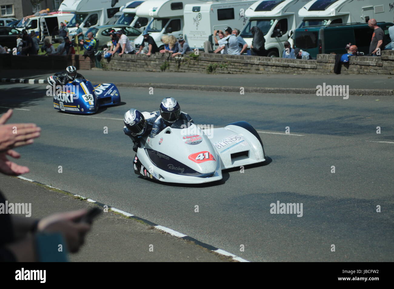 Isle Of Man, British Isles (UK). 9th June, 2017.  Exciting racing as number 36, Franck Barbier and Goulven Crochemore chase number 41 Kevin Thornton and Dave Dean through Cruickshank's Corner, Ramsey, Isle of Man, UK. Sure Sidecar TT Race 2. (Detailed competitor information: https://www.iomtt.com/TT-Database.aspx) Credit: Louisa Jane Bawden/Alamy Live News. Stock Photo