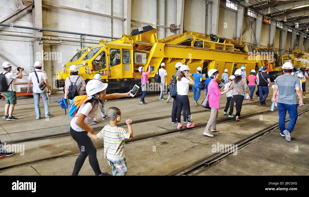 Beijing, China. 10th June, 2017. Citizens visit the CRRC Beijing Locomotive Co., Ltd in Beijing, capital of China, June 10, 2017. An open day activity was held at the 120-year-old state-owned corporation on Saturday, attracting many citizens. The corporation was found in 1897, selling its railway products of locomotives and engineering machinery to customers at home and abroad. Credit: Li Xin/Xinhua/Alamy Live News Stock Photo