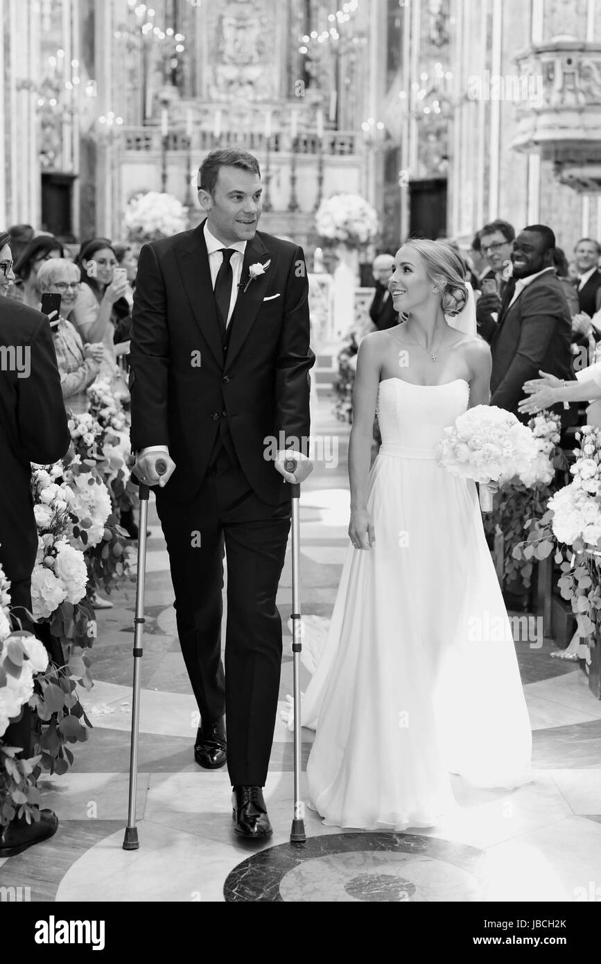 HANDOUT - A handout picture made available on 09 June 2017 shows German soccer national player and German Bundesliga goalkeeper of the FC Bayern Munich, Manuel Neuer, and his wife Nina Neuer (née Weiss) during the church wedding in Monopoli, Italy, 09 June 2017.   (ATTENTION EDITORS: FOR EDITORIAL USE ONLY IN CONNECTION WITH CURRENT REPORTING/ MANDATORY CREDIT) · NO WIRE SERVICE · Photo: Pia Clodi/peachesandmint.com/dpa Stock Photo