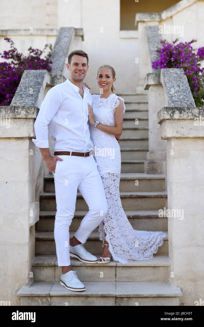 Monopoli, Italy. 09th June, 2017. HANDOUT - A handout picture made available on 09 June 2017 shows German soccer national player and German Bundesliga goalkeeper of the FC Bayern Munich, Manuel Neuer, and his wife Nina Neuer (née Weiss) shortly after the church wedding in Monopoli, Italy, 09 June 2017. (ATTENTION EDITORS: FOR EDITORIAL USE ONLY IN CONNECTION WITH CURRENT REPORTING/ MANDATORY CREDIT) · NO WIRE SERVICE · Photo: Pia Clodi/peachesandmint.com/dpa/Alamy Live News Stock Photo