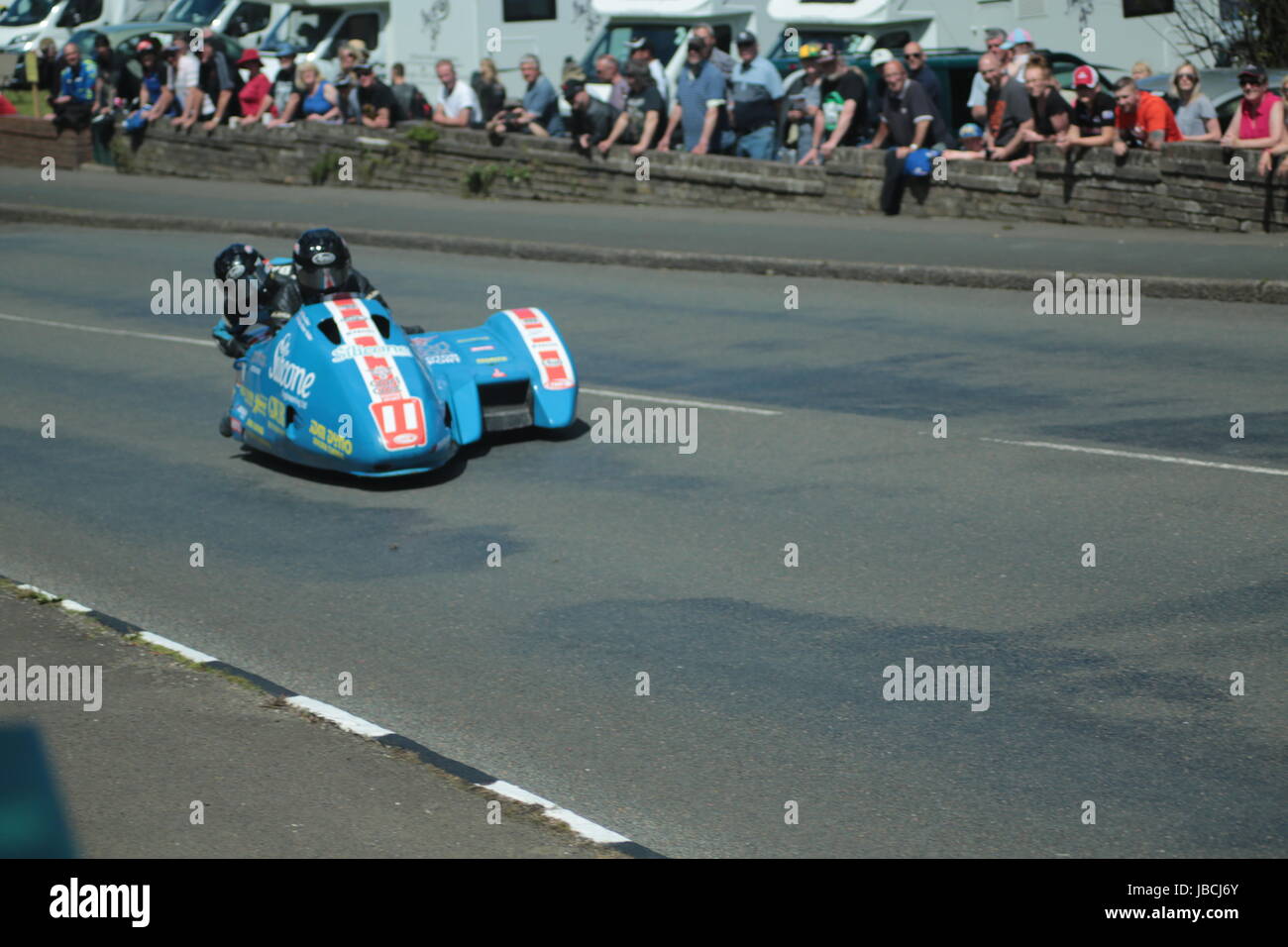 Isle Of Man, British Isles (UK). 9th June, 2017.  Fan Favorites, number 11 Tony Baker and Fiona Baker-Holden at Cruickshank's Corner, Ramsey, Isle of Man, UK. Sure Sidecar TT Race 2. Sidecar 11. (Detailed competitor information: https://www.iomtt.com/TT-Database.aspx) Credit: Louisa Jane Bawden/Alamy Live News. Stock Photo