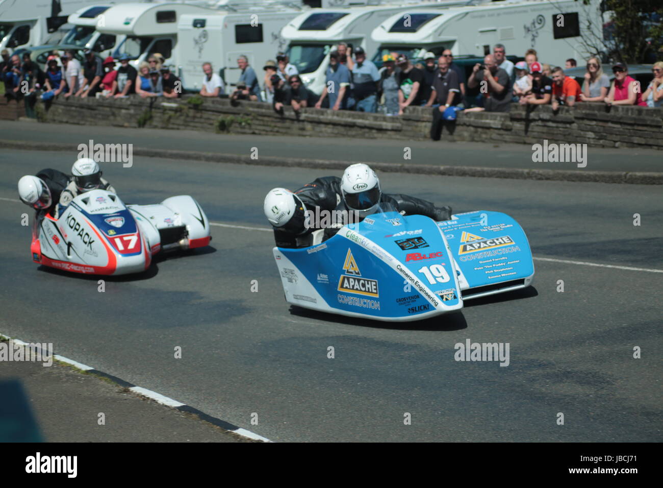 Isle Of Man, British Isles (UK). 9th June, 2017.  Exciting racing as number 17, Mike Roscher and Ben Hughes chase number 19 Darren Hope and Shaun Parke through Cruickshank's Corner, Ramsey, Isle of Man, UK. Sure Sidecar TT Race 2cCredit: Louisa Jane Bawden/Alamy Live News. Stock Photo