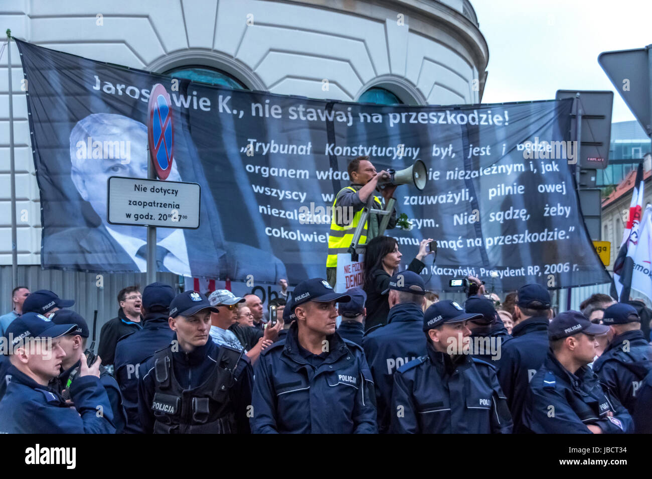 Warsaw, Poland - June 10th, 2017: Members of Polish security forces watch over as anti-government protesters block the Polish capital during the 86th monthly anniversary of the Smolensk crash in April, 2010. Stock Photo