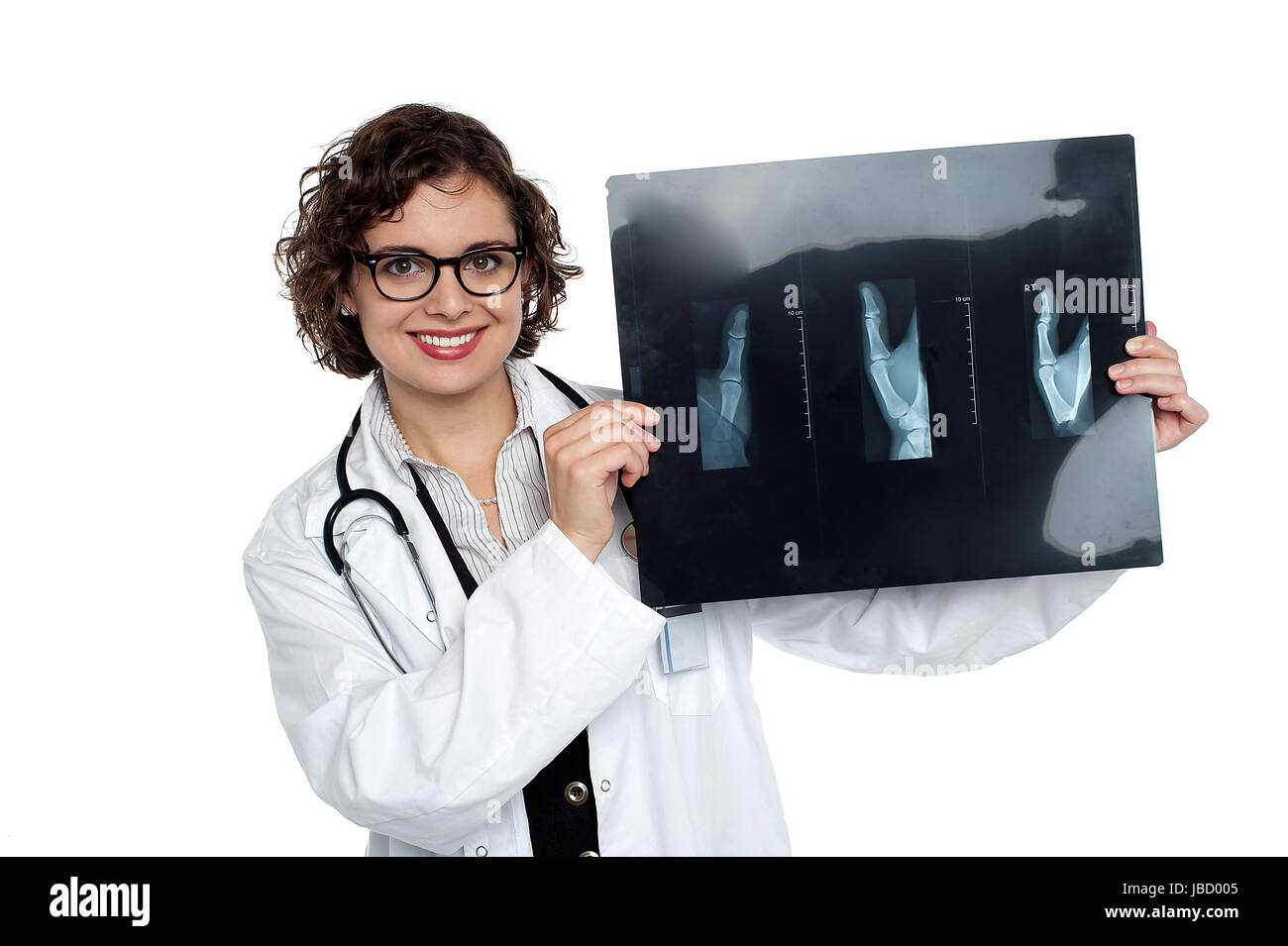 Orthopedic surgeon displaying patients xray sheet to the camera Stock
