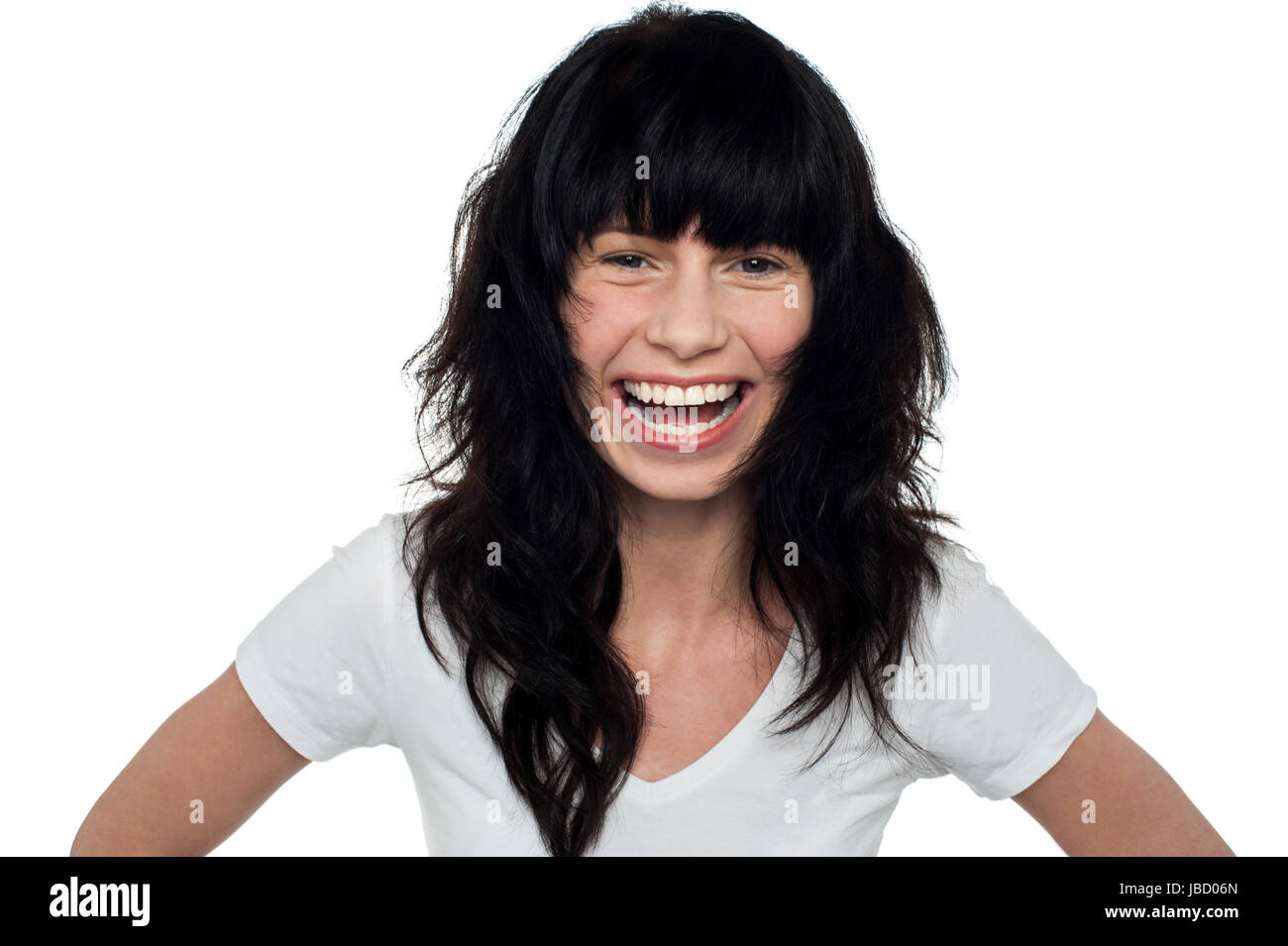 Attractive cheerful girl with long hair laughing heartily