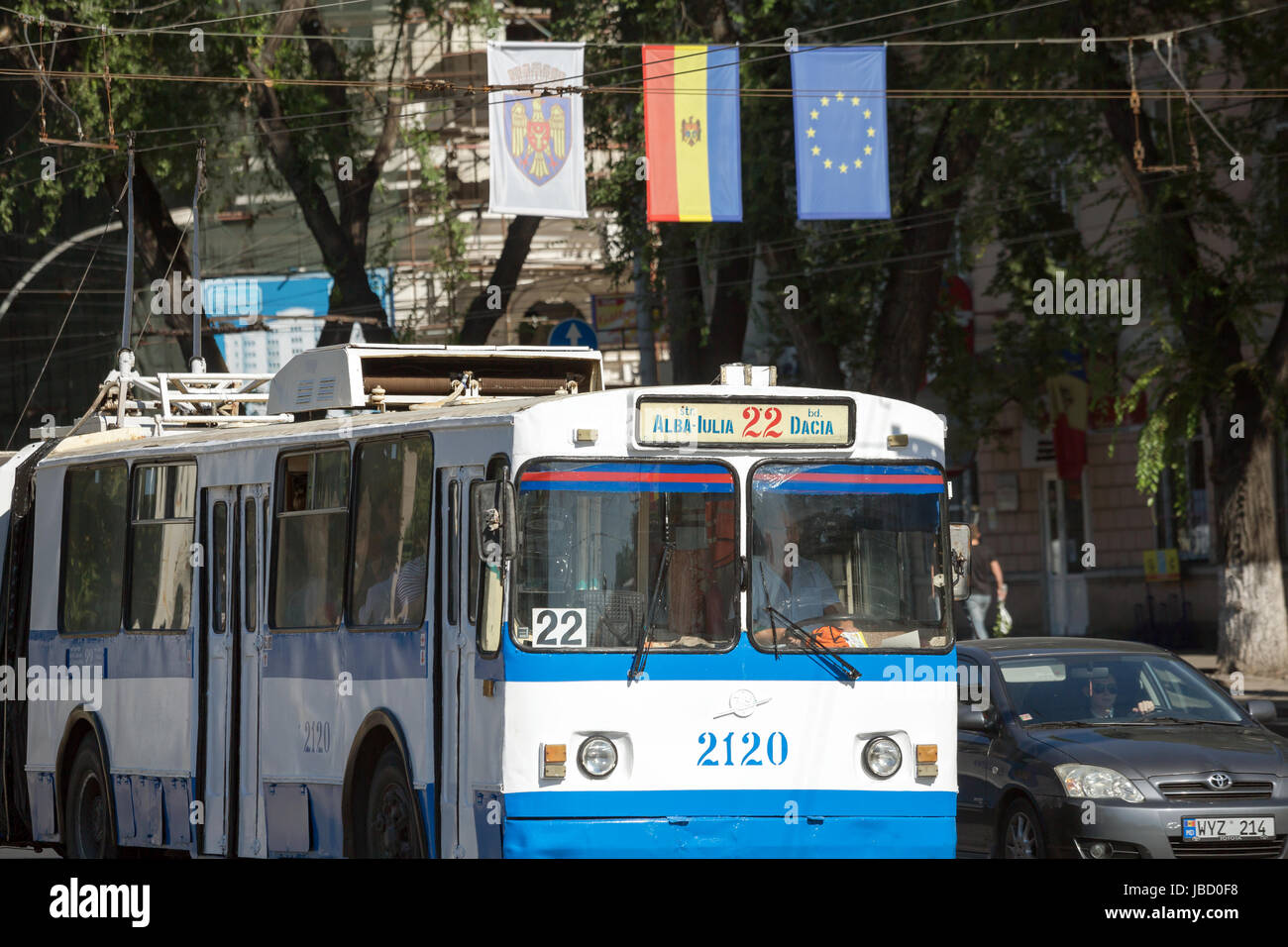 01.09.2016, Moldova, Chisinau, Chisinau - Trolleybus and flag of the Republic of Moldova, the EU flag as well as a flag with the coat of arms of Chisinau next to each other over the Bulevardul Stefan cel Mare si Sint. 00A160901D051CAROEX.JPG - NOT for SALE in G E R M A N Y, A U S T R I A, S W I T Z E R L A N D [MODEL RELEASE: NO, PROPERTY RELEASE: NO (c) caro photo agency / Bastian, http://www.caro-images.pl, info@carofoto.pl - In case of using the picture for any purposes, please contact the agency - the picture is subject to royalty!] Stock Photo