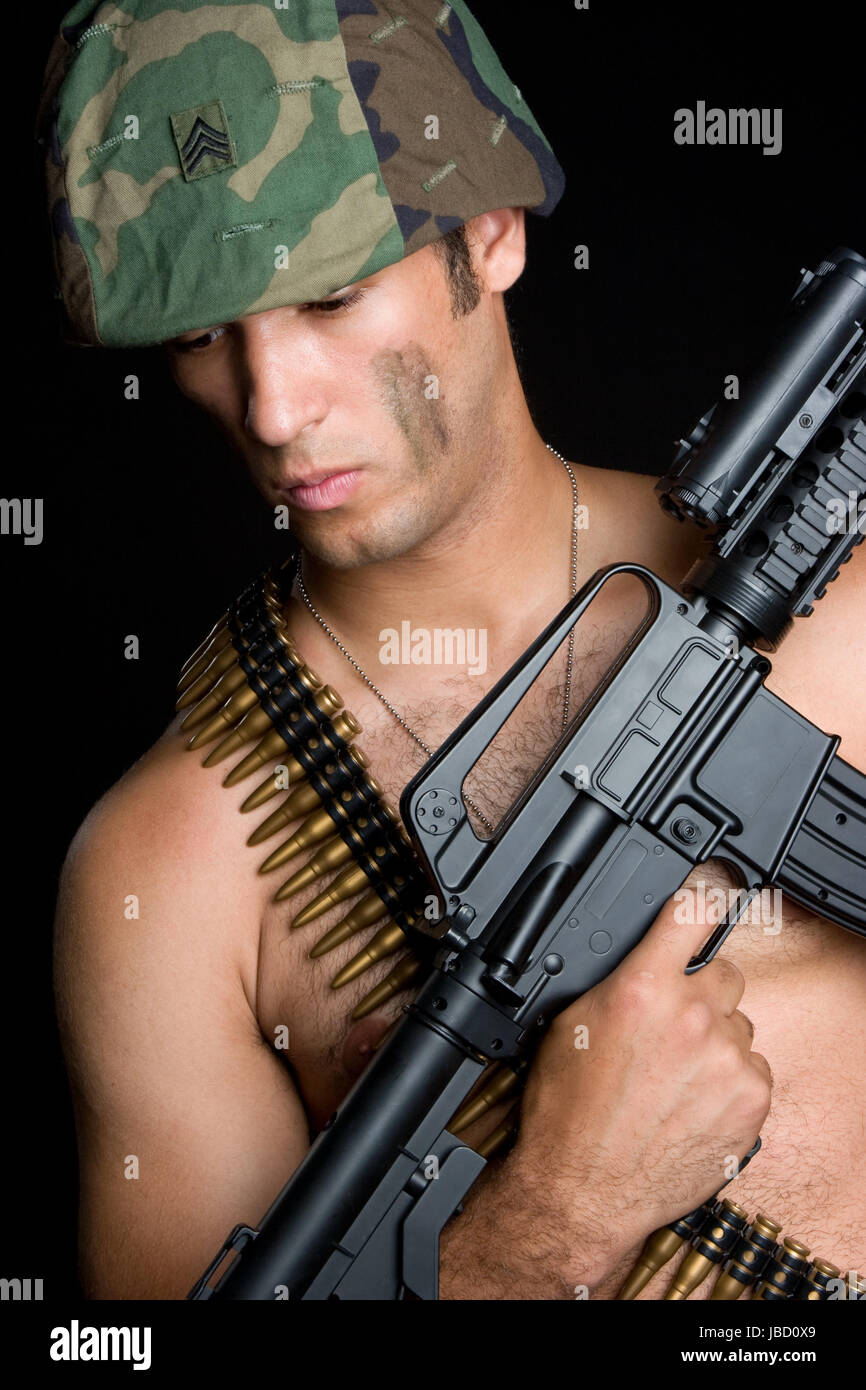Army man holding machine gun Stock Photo Alamy