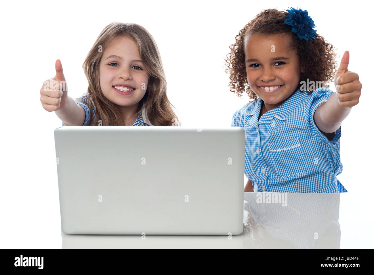 School kids with laptop gesturing thumbs up Stock Photo - Alamy