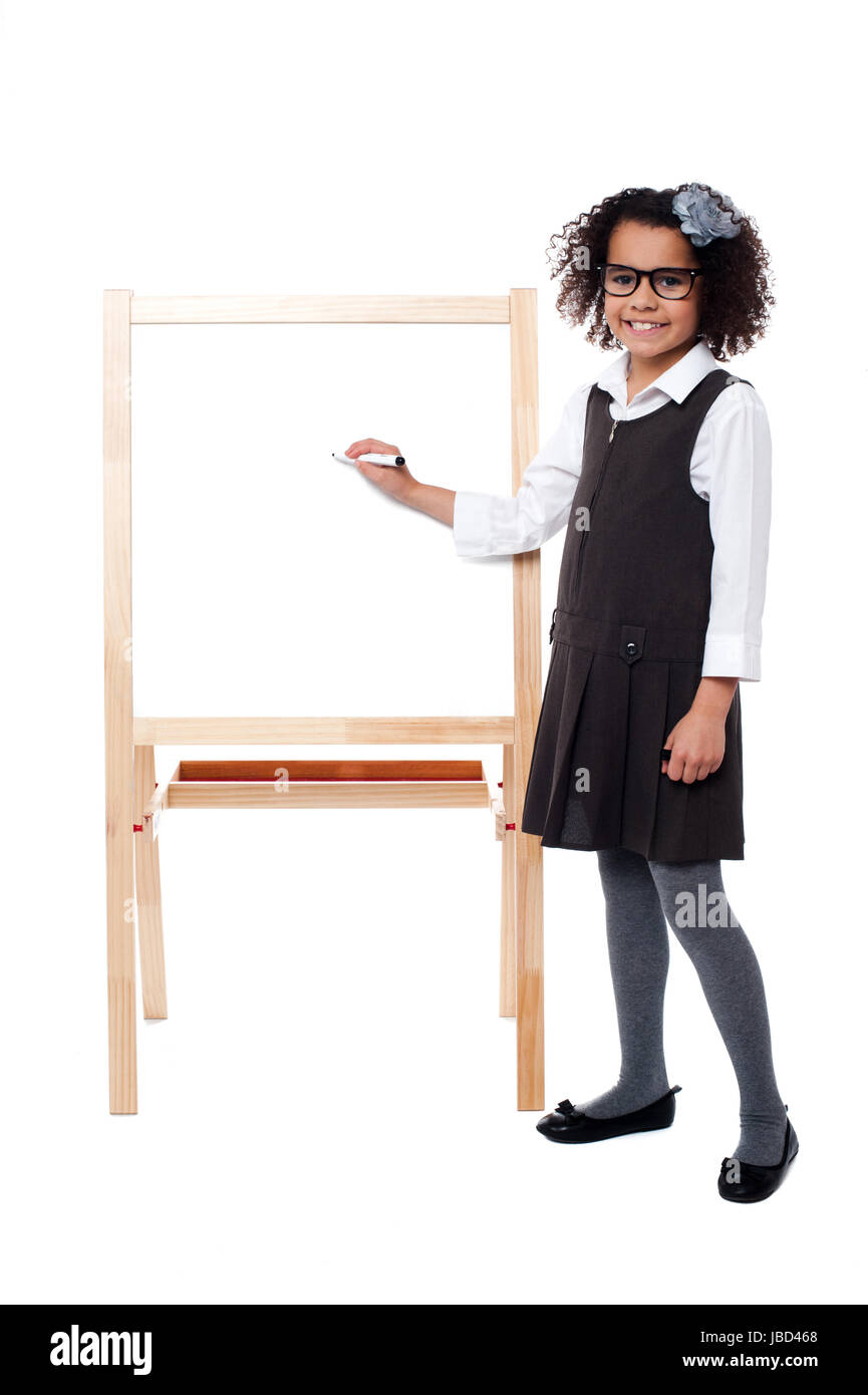 Girl about to write on whiteboard with marker pen Stock Photo Alamy