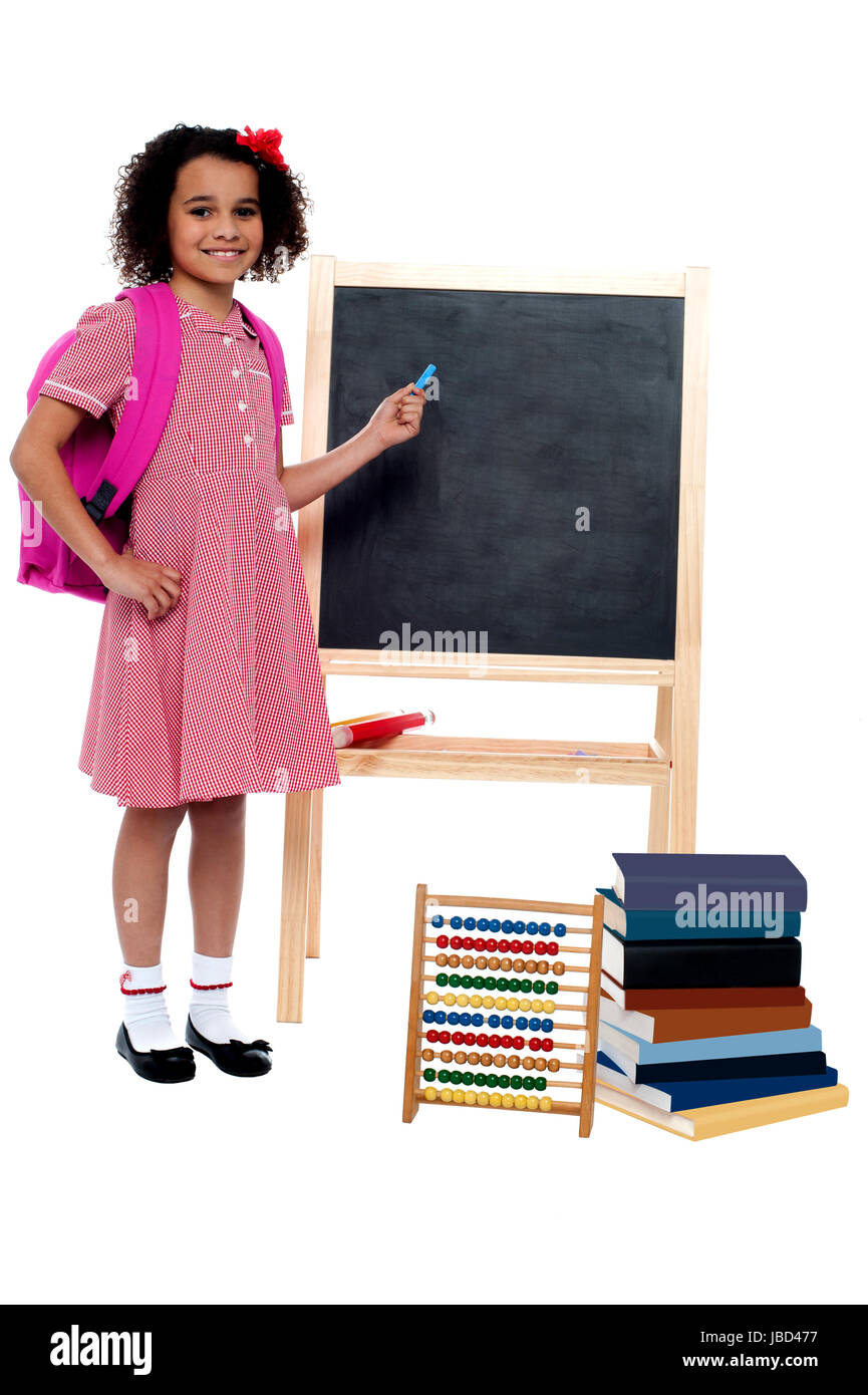 Charming young school kid with stationery around Stock Photo