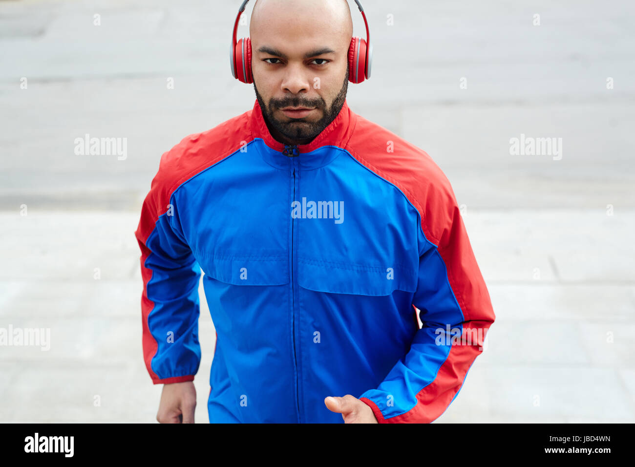 Young sprinter in activewear training outdoors Stock Photo - Alamy