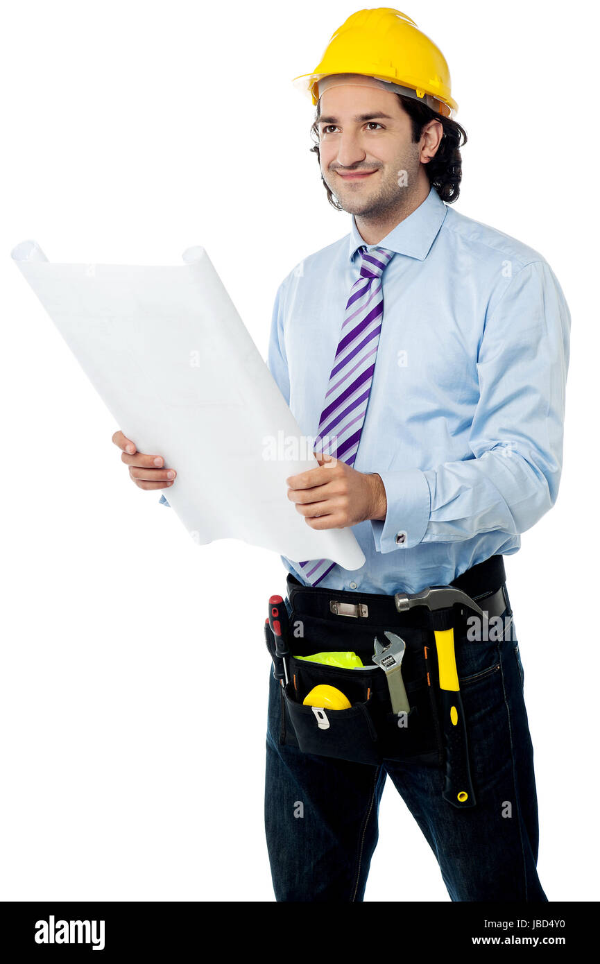 Smiling construction worker holding blueprint Stock Photo - Alamy