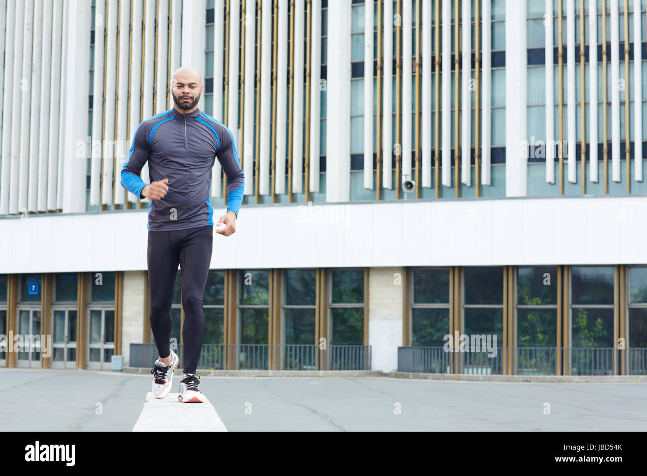 Active sprinter running in the city Stock Photo - Alamy