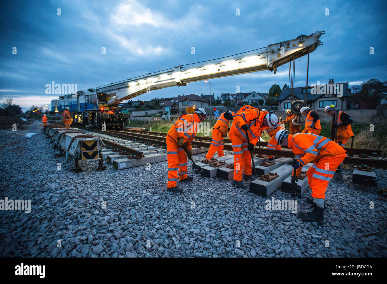 Rail construction workers laying new tracks Stock Photo Alamy